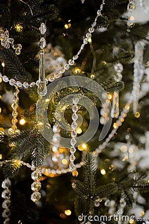 tylish glass crystal transparent toys on the Christmas tree. Beige tones. Banner for web page design. The concept of a Stock Photo