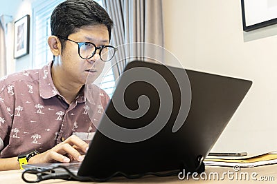 The type of company that allows employees to work at home instead of working at the company Stock Photo