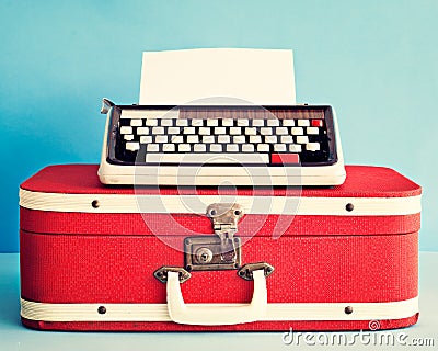 Typewriter over suitcase Stock Photo