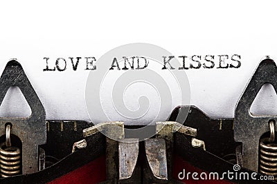 Typewriter with text love and kisses Stock Photo