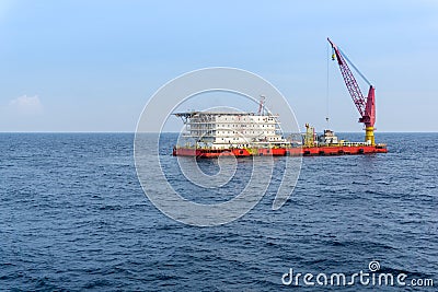 A typical accommodation construction work barge at oil field Stock Photo