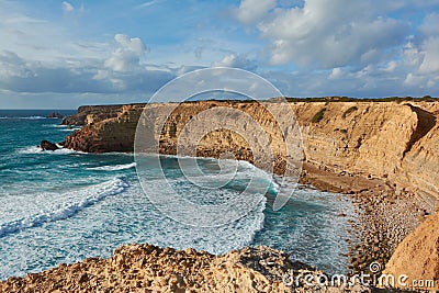 Typical Algarvian landscape with limestone rocks washed by the waves. Bordeira, Portugal Stock Photo