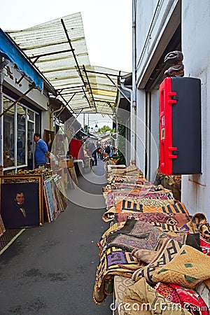 A typical alley sight of Marche aux Puces de Saint-Ouen, Paris, France Editorial Stock Photo