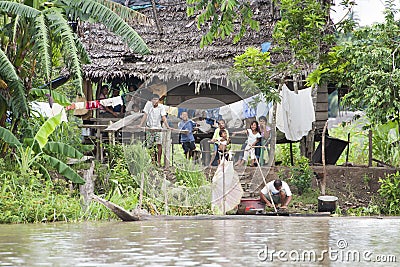 Typical Amazon Home with inhabitants (Amazonia) Editorial Stock Photo