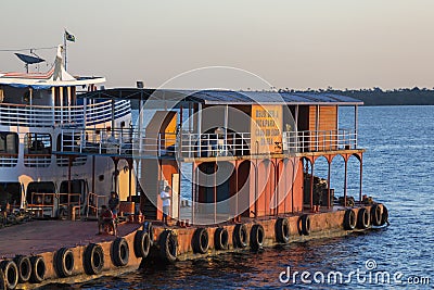 Typical Amazon wooden boat on Rio Negro in Manaus harbor, Brazil Editorial Stock Photo