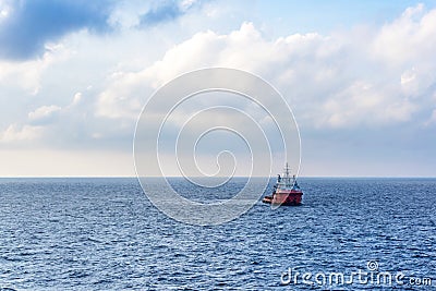A typical anchor handling tug boat at oil field Stock Photo