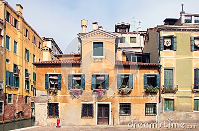 Typical ancient medieval venetian house with orange plaster wall Stock Photo