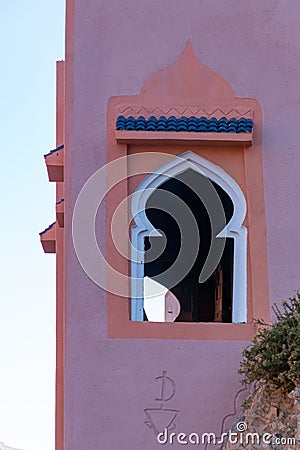 Typical arabesque window on facade in a construction of Morocco Stock Photo