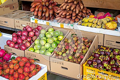 Typical Asian fruit market. Fresh tropical fruits are on the market window. Healthy, organic food Editorial Stock Photo