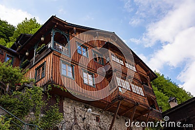 Typical Austrian Alpine house with bright flowers, Hallstatt, Austria, Europe Stock Photo