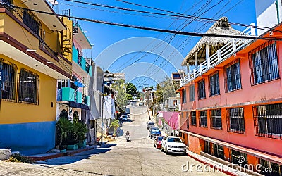 Typical beautiful colorful tourist street sidewalk city Puerto Escondido Mexico Editorial Stock Photo
