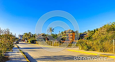 Typical beautiful colorful tourist street sidewalk city Puerto Escondido Mexico Editorial Stock Photo