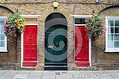 Typical British doors with doorbell in London. Two colorfull doors Stock Photo