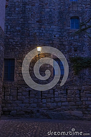 cobbled street of the town of pals in the spanish costa brava at night Stock Photo