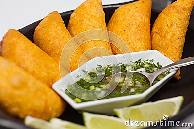 Typical Colombian empanadas served with spicy sauce Stock Photo