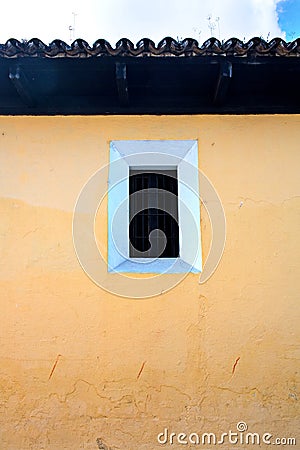 Typical colonial house wall and roof and window, Antigua, Guatemala Stock Photo