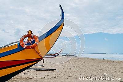 Typical colourful Moliceiro fishing boats on the beach in Espinho, Portugal Stock Photo