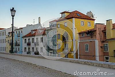 Typical exterior of old houses in a narrow street in Lisbon Stock Photo