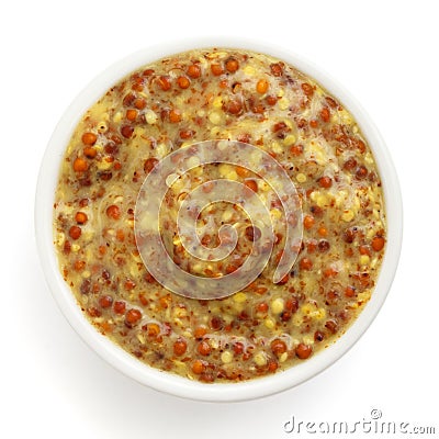 Typical french dijon rough mustard in round dish Stock Photo