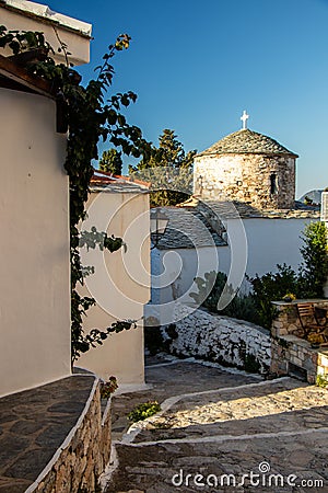 Typical Greek Church Bells and Cross and Sea at the Background at the Aegean Sea and the Sporades on the Greek Island of Alonissos Stock Photo