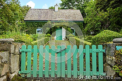 A typical Irish cottage surrounded by a green garden Stock Photo