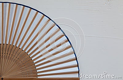 Typical Japanese hand fan made on the wooden white desk Stock Photo