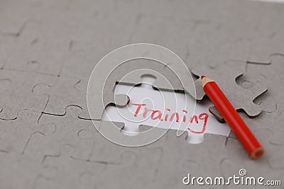 A typical jigsaw puzzle with training and red crayon Stock Photo