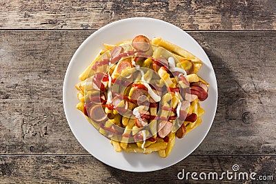 Typical Latin America Salchipapa. Sausages with fries, ketchup,mayo and mustard Stock Photo