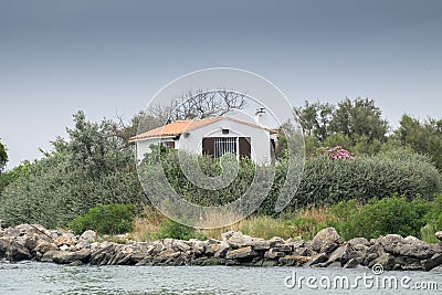 Typical little house on Rhone River bank. Camargue Park Stock Photo