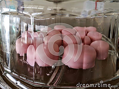 Typical Mauritian pastries: pink Napolitaines. Stock Photo