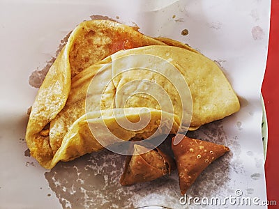 Typical Mauritian street food. Dal pouri and gato pima. Stock Photo