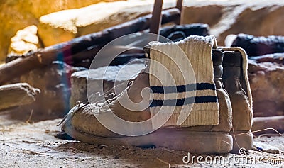 Typical mountain climb shoes with a white sock in it, basic survival equipment Stock Photo