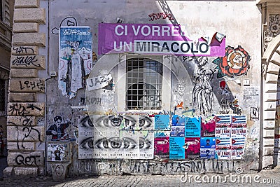 Typical murals and poster at a house wall in roman quarter Trastevere Editorial Stock Photo