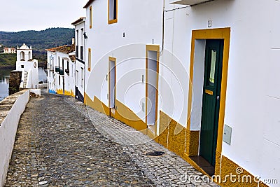 Typical narrow street in the ancient town of Mertola, Alentejo R Stock Photo