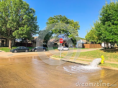 Typical neighborhood area with stop sign near Dallas, Texas, America with open yellow fire hydrant Stock Photo