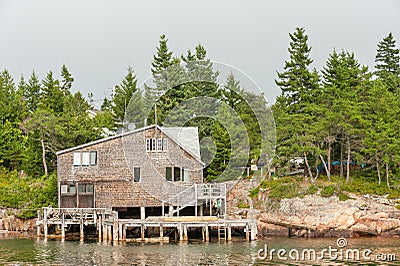 Shingled waterfront house Stock Photo