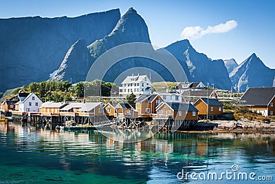 Typical Norwegian fishing village with traditional red rorbu hut Stock Photo