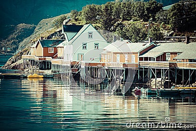 Typical Norwegian fishing village with traditional red rorbu hut Stock Photo