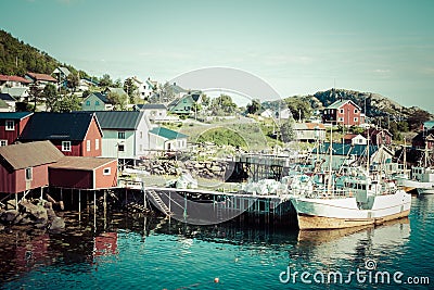 Typical Norwegian fishing village with traditional red rorbu hut Stock Photo