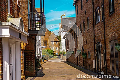 Typical old English buildings, low brick buildings across a narrow street, interesting old London architecture Stock Photo