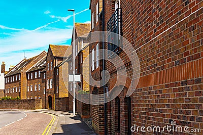 Typical old English buildings, low brick buildings across a narrow street, interesting old London architecture Stock Photo