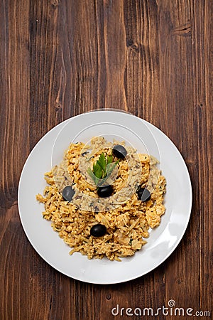 Typical portuguese dish bacalhau a bras with black olives on dish Stock Photo