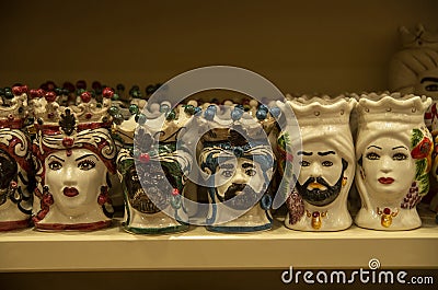 Typical pottery with human heads in shop in Sicilia, Italy Editorial Stock Photo