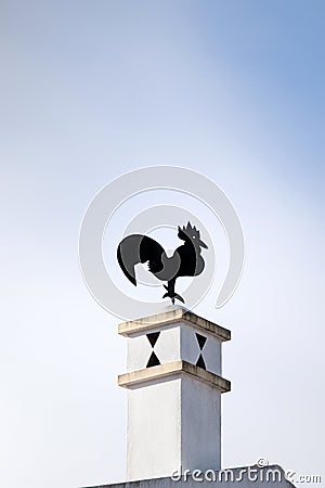 Typical rooster on chimney Stock Photo