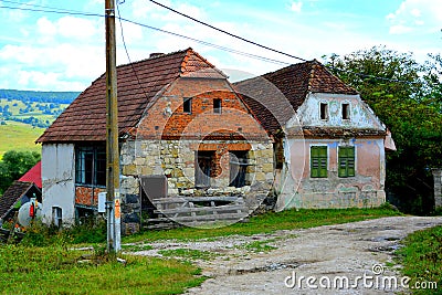 Typical rural landscape and peasant houses in the village Drauseni, Transylvania, Romania. Editorial Stock Photo