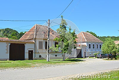 Typical rural landscape and peasant houses in the village Mesendorf Meschenderf, Meschendorf, Mesche, Transylvania, Romania Editorial Stock Photo