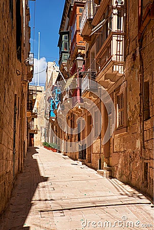 A typical small street (Saint Dominic) of Birgu, Malta Stock Photo