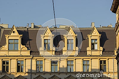 Typical street scene in the central of Poznan, old town with architecture facades of urban housing. Row of windows. Stock Photo