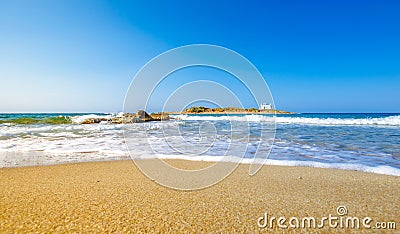 Typical summer image of an amazing pictorial view of a sandy beach and an old white church in a small isl Stock Photo