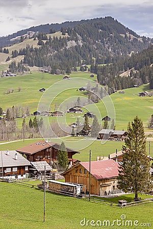 Typical Swiss village on valley. Stock Photo